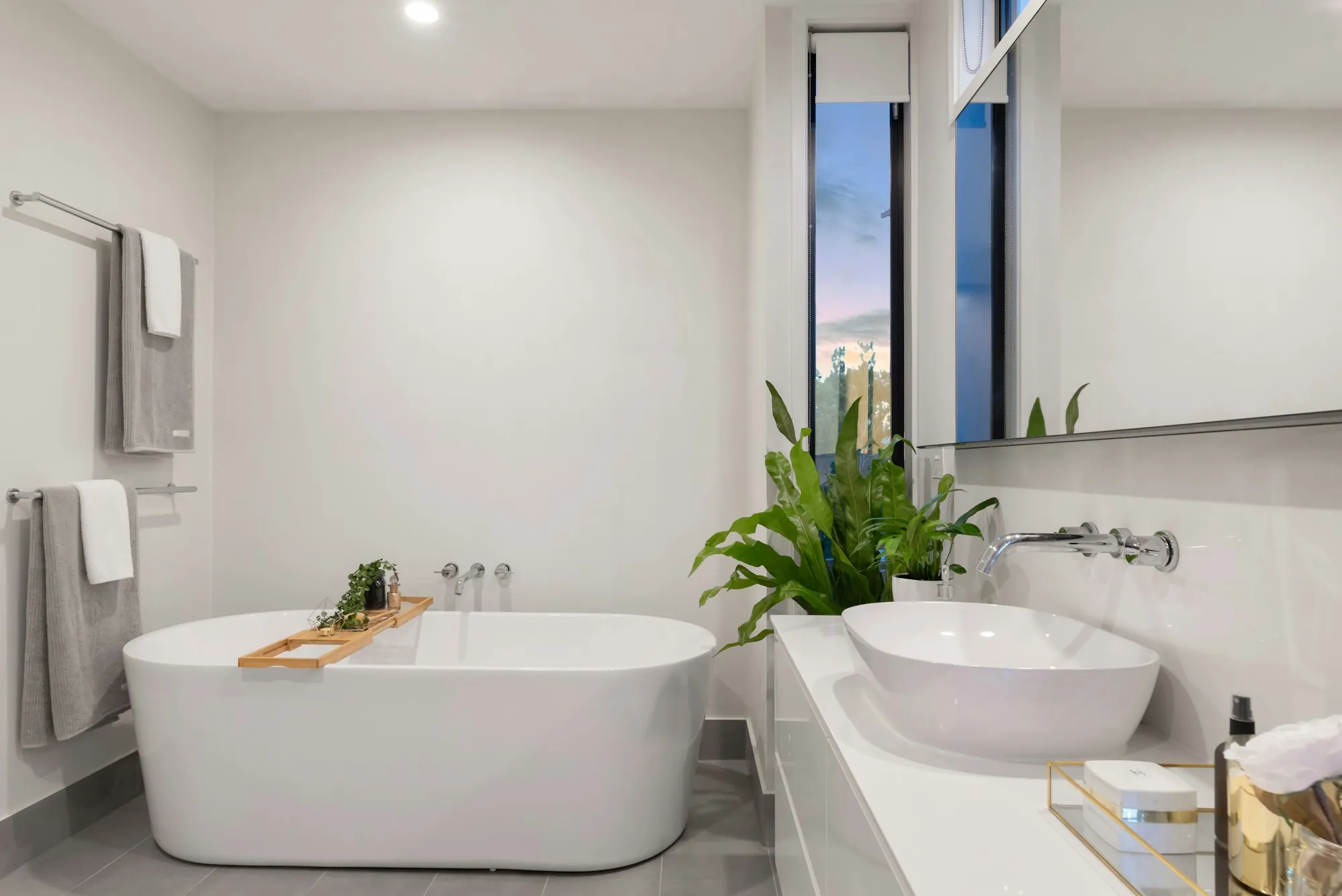 Bathroom with a tiled walk-in shower and a floating vanity
