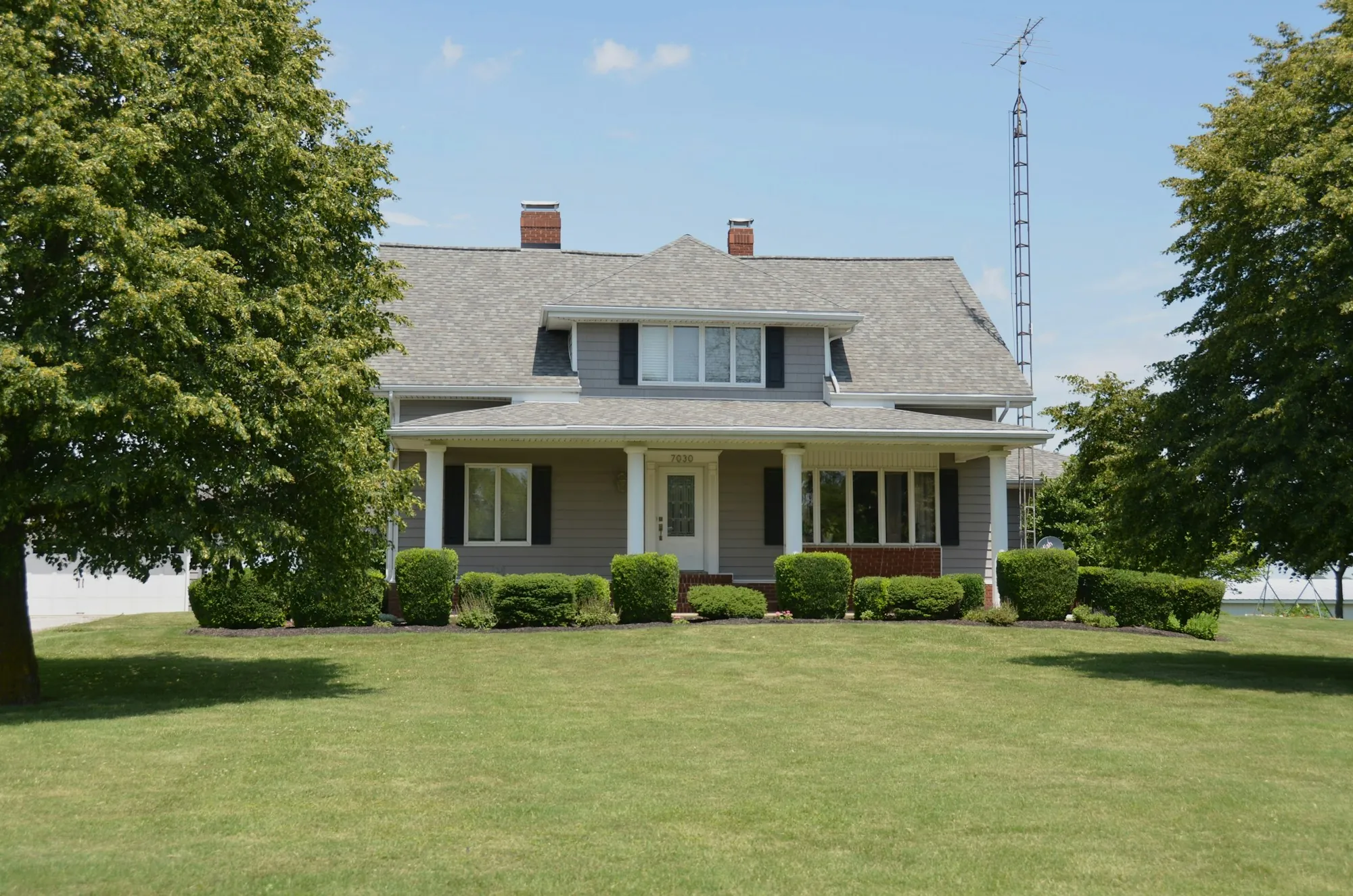 New family room addition with large windows and a vaulted ceiling