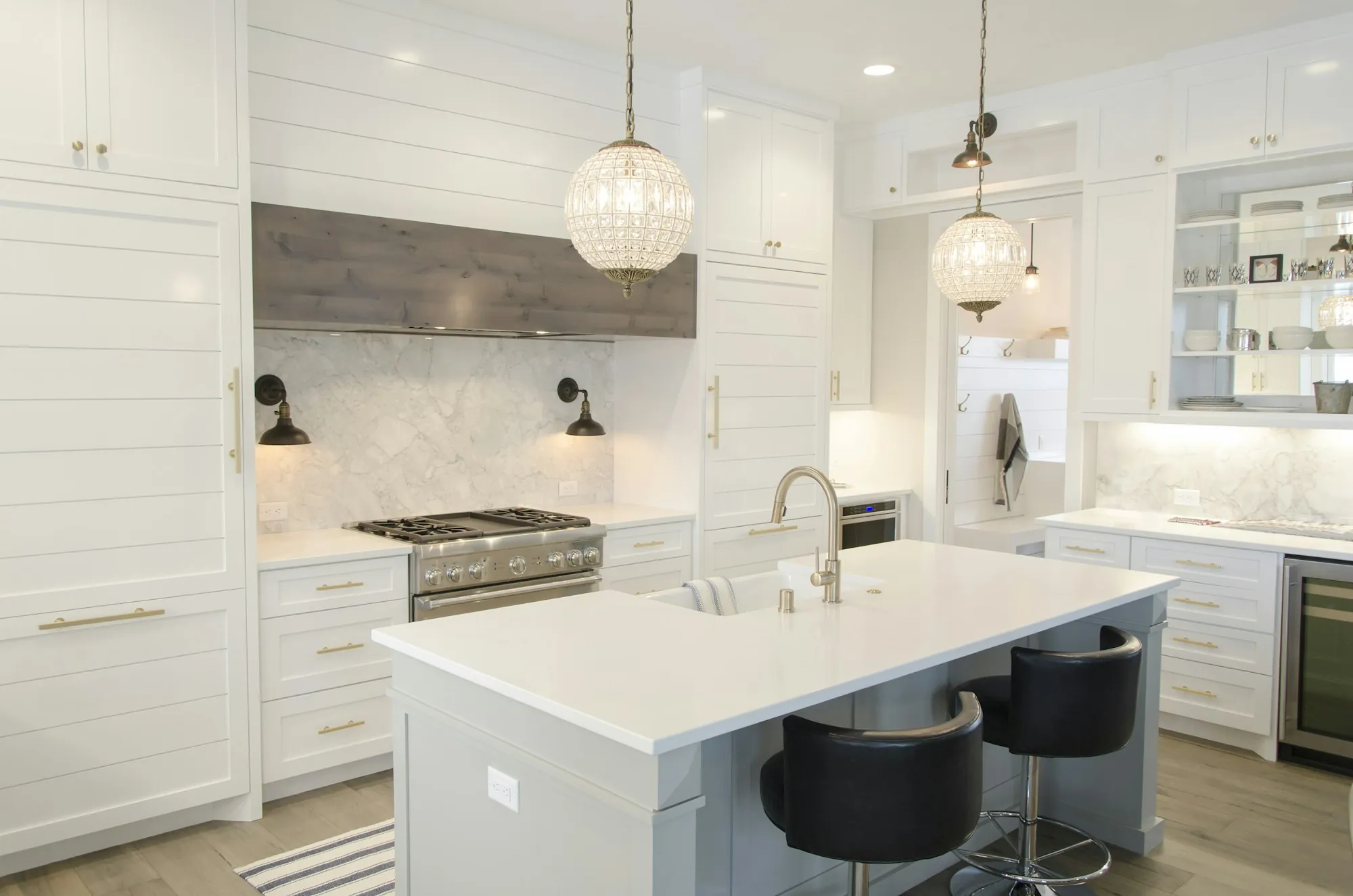 Kitchen with shaker cabinets, stone counters and a center island